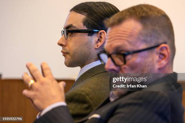 Senior deputy public defender Randall Bethune, right, and Marcus Anthony Eriz, a Costa Mesa man accused of killing a 6-year-old Aiden Leos in a...