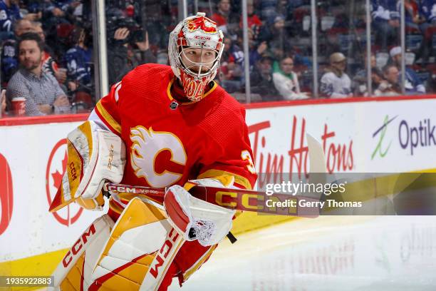 Dustin Wolf of the Calgary Flames skates during warmup prior to the game against the Toronto Maple Leafs at Scotiabank Saddledome on January 18, 2024...