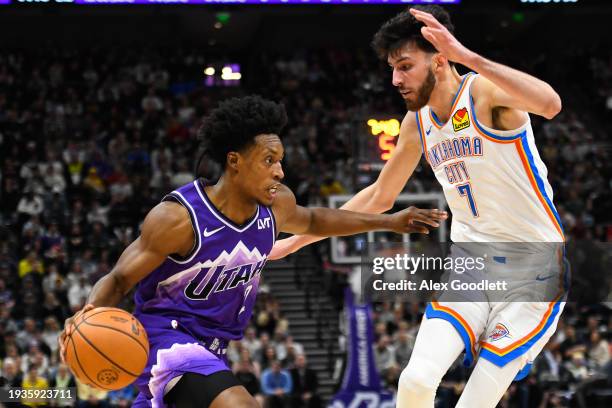 Collin Sexton of the Utah Jazz drives against Chet Holmgren of the Oklahoma City Thunder during the first half of a game at Delta Center on January...