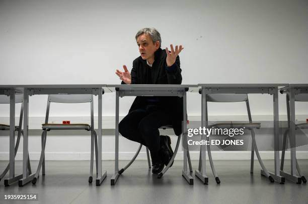 Laurent Sourisseau, known as "Riss", publishing director of French satirical magazine "Charlie Hebdo", poses for a photo after speaking to AFP in...