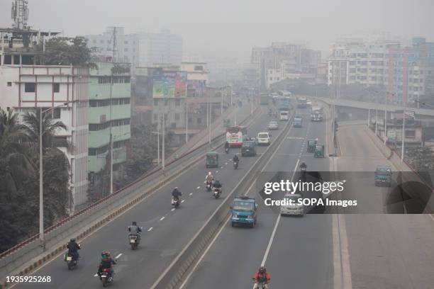 Dense fog covers the skyline of Dhaka.