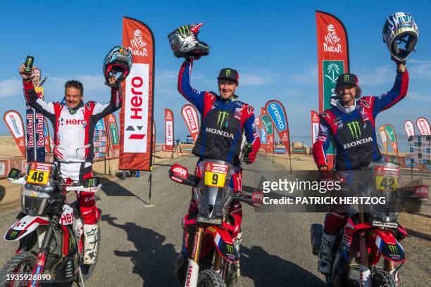 Second-placed Hero Motosports Team Rally's Botswanan biker Ross Branch, winner Monster Energy Honda Team's US biker Ricky Brabec and third-placed...