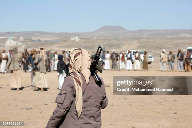 Houthi followers protest to condemn the U.S.-U.K. During a tribal gathering on January 14, 2024 on the outskirts of Sana'a, Yemen. Houthi followers...