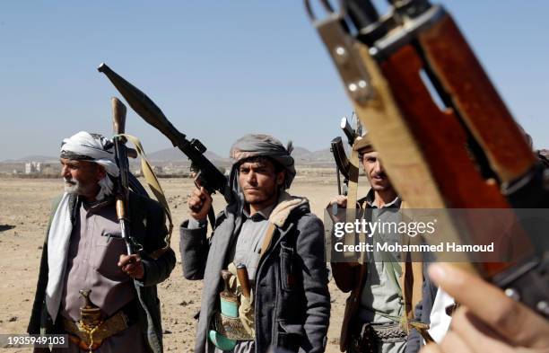 Houthi followers protest to condemn the U.S.-U.K. During a tribal gathering on January 14, 2024 on the outskirts of Sana'a, Yemen. Houthi followers...