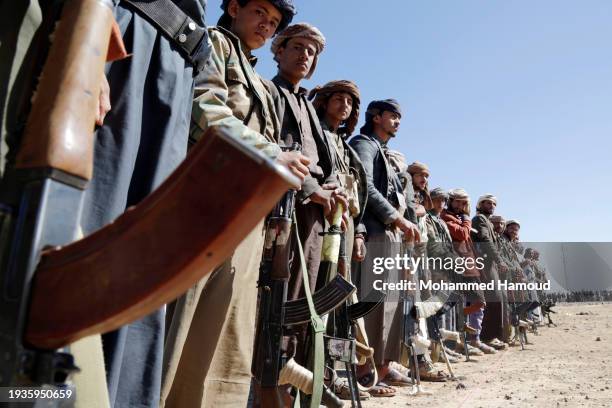 Houthi followers protest to condemn the U.S.-U.K. During a tribal gathering on January 14, 2024 on the outskirts of Sana'a, Yemen. Houthi followers...