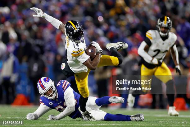 George Pickens of the Pittsburgh Steelers catches a pass against Micah Hyde of the Buffalo Bills during the third quarter at Highmark Stadium on...