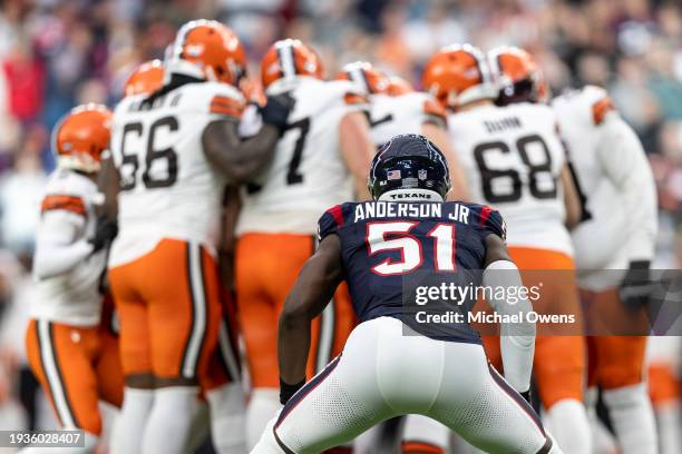 Will Anderson Jr. #51 of the Houston Texans looks on as Cleveland Browns huddles during an NFL wild-card playoff football game between the Houston...