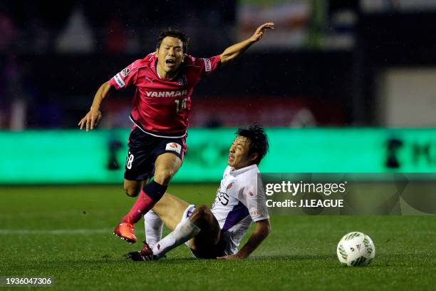Shohei Kiyohara of Cerezo Osaka is tackled by Yuki Honda of Kyoto Sanga during the J.League J1 Promotion Play-Off semi final between Cerezo Osaka and...