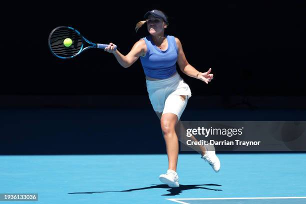 Sofia Kenin of the United States plays a forehand in their round one singles match against Iga Swiatek of Poland during the 2024 Australian Open at...