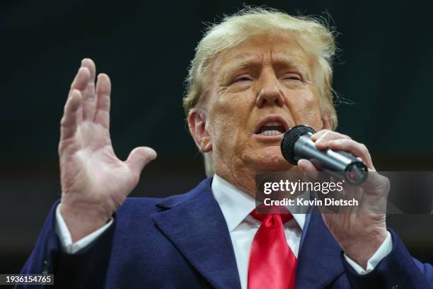 Former president Donald Trump speaks to voters during a visit to a caucus site at the Horizon Event Center on January 15, 2024 in Clive, Iowa. Iowans...