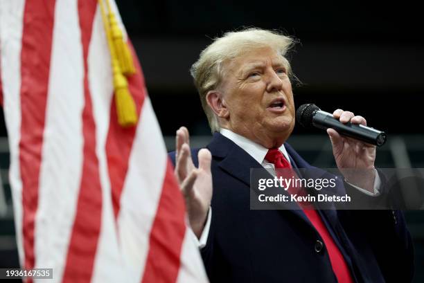 Former president Donald Trump speaks to voters during a visit to a caucus site at the Horizon Event Center on January 15, 2024 in Clive, Iowa. Iowans...