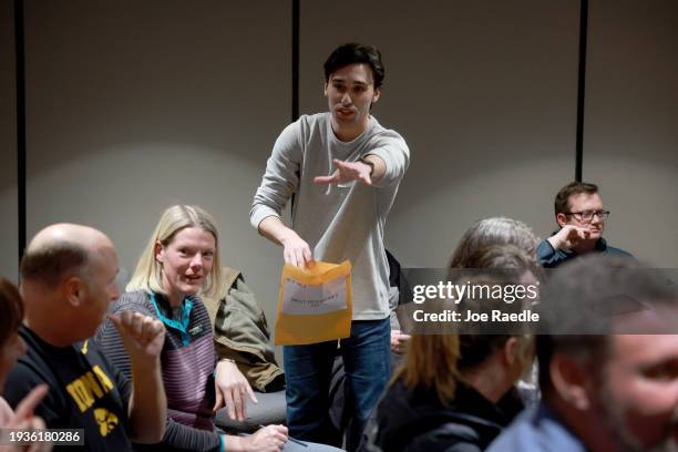 Caucus official collects ballots cast during a Republican caucus on January 15 in West Des Moines, Iowa. Iowans are voting today in the state’s...