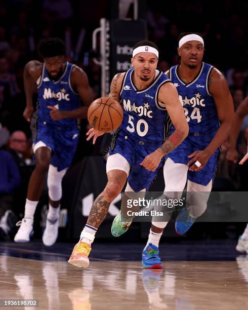 Cole Anthony of the Orlando Magic takes the ball as teammates Wendell Carter Jr. #34 and Jonathan Isaac of the Orlando Magic follow in the first half...