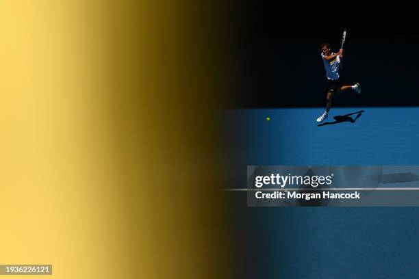Albert Ramos-Vinolas of Spain plays a backhand in their round one singles match against Casper Ruud of Norway during the 2024 Australian Open at...