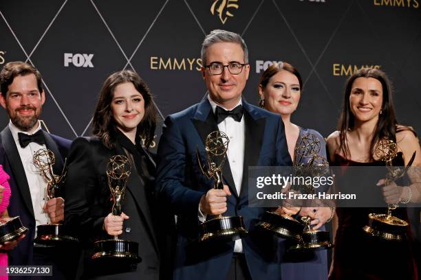 John Oliver and winners of Outstanding Writing For A Variety Series for "Last Week Tonight With John Oliver" pose in the press room during the 75th...