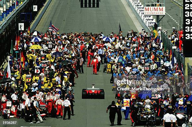 General view of Team Ferrari driver Michael Schumacher of Germany on the grid before the FIA Formula One Grand Prix held on September 29, 2002 at the...