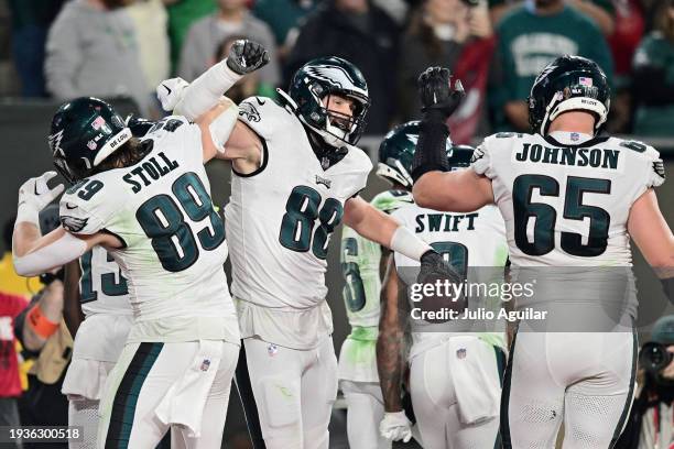 Dallas Goedert of the Philadelphia Eagles celebrates with Jack Stoll and Lane Johnson after scoring a touchdown against the Tampa Bay Buccaneers...