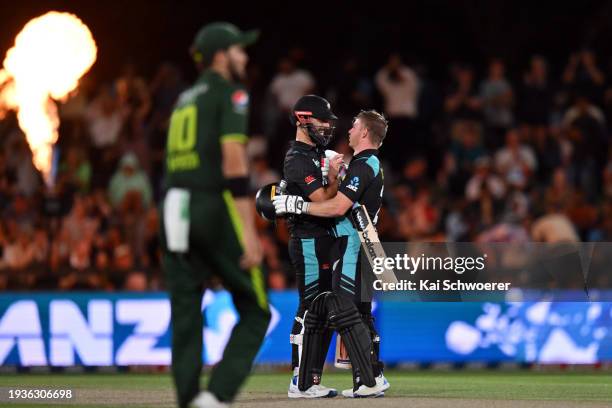 Daryl Mitchell and Glenn Phillips of New Zealand celebrate their win in game four of the Men's T20 series between New Zealand and Pakistan at Hagley...