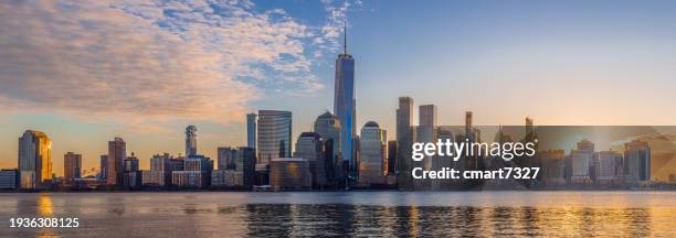the freedom tower and nyc skyline - waterfront property stock pictures, royalty-free photos & images