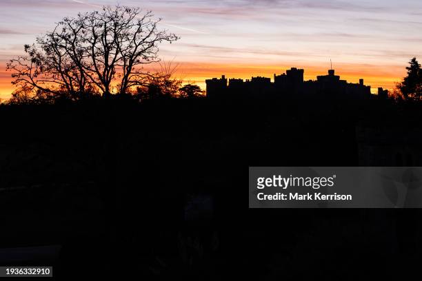 Windsor Castle is viewed in silhouette from Home Park at sunset on 15th January 2024 in Windsor, United Kingdom.