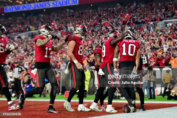 Trey Palmer of the Tampa Bay Buccaneers celebrates with his teammates after scoring a 56 yard touchdown against the Philadelphia Eagles during the...