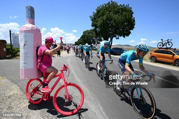 Christian Scaroni of Italy and Astana Qazaqstan Team and the peloton competing while a fan cheers during the 24th Santos Tour Down Under 2024, Stage...