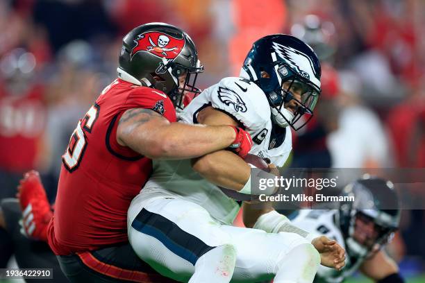 Greg Gaines of the Tampa Bay Buccaneers sacks Jalen Hurts of the Philadelphia Eagles during the fourth quarter in the NFC Wild Card Playoffs at...