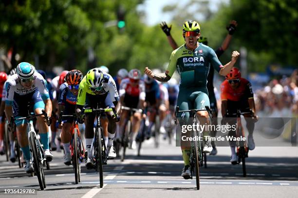 General view of Sam Welsford of Australia and Team BORA - Hansgrohe celebrates at finish line as stage winner ahead of Biniam Girmay Hailu of Eritrea...