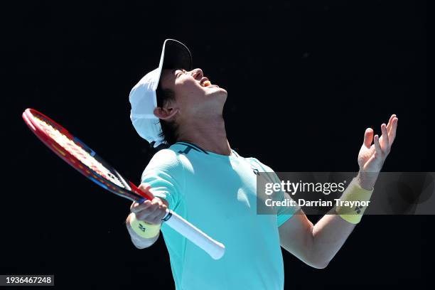 Yoshihito Nishioka of Japan reacts in their round one singles match against Holger Rune of Denmark during the 2024 Australian Open at Melbourne Park...