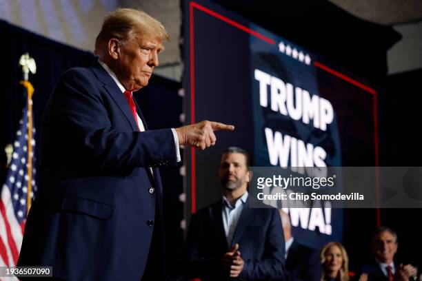 Republican presidential candidate, former U.S. President Donald Trump acknowledges supporters during his caucus night event at the Iowa Events Center...