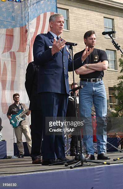 Chairman of the Joint Chiefs of Staff General Richard Myers introduces country singer Darryl Worley when he performed a concert at the Pentagon that...