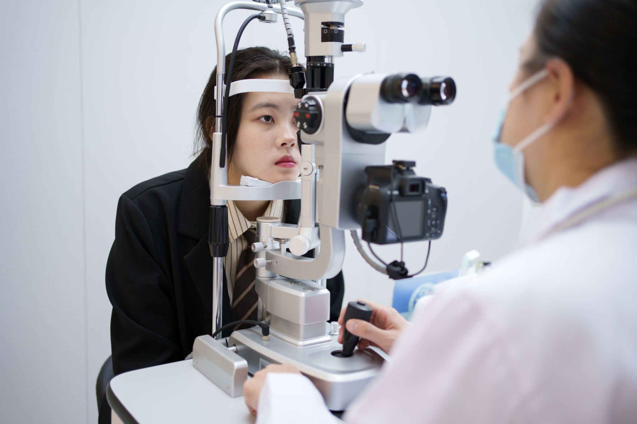 Young man checking his eyesight Young man checking his eyesight