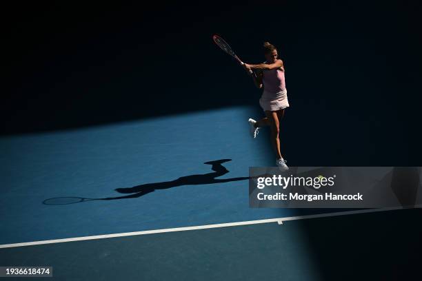 Camila Giorgi of Italy plays a backhand in their round one singles match against Victoria Azarenka during the 2024 Australian Open at Melbourne Park...