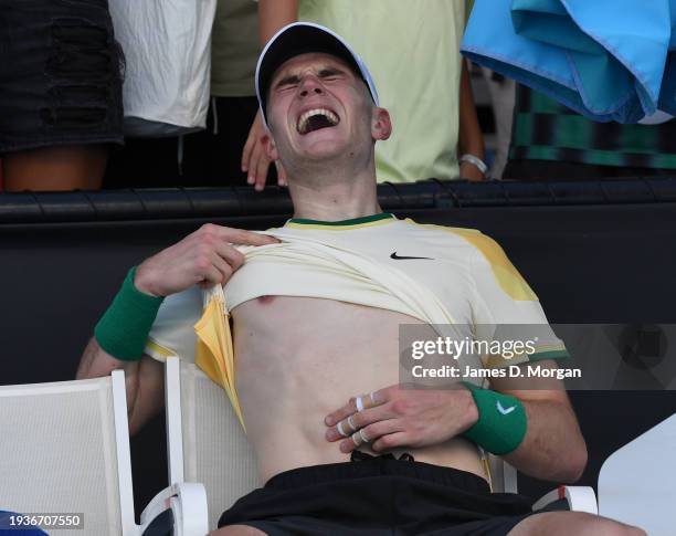 Jack Draper of Great Britain screams in pain after winning in their round one singles match against Marcos Giron of the United States during the 2024...