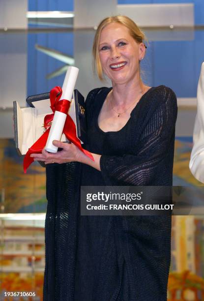 Finnish actress Kati Outinen poses for photogaphers after winning the Best actress award for his work in "L'Homme sans passé" by Finnish director Aki...