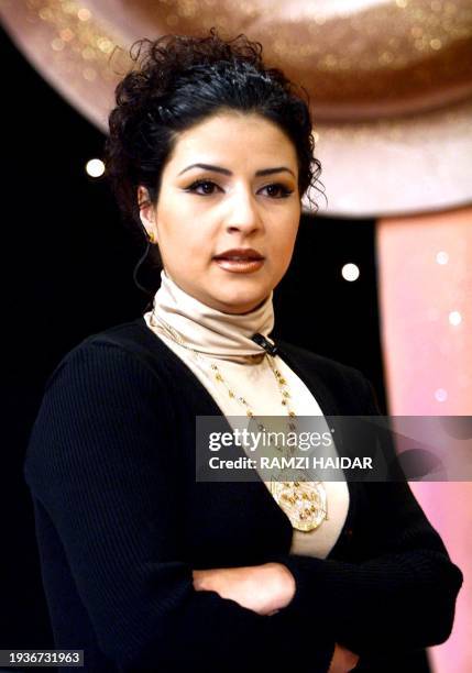 Lebanese actress Maggie Abi Ghosn poses for a picture during the taping of a TV program at NTV station 10 December 2001.