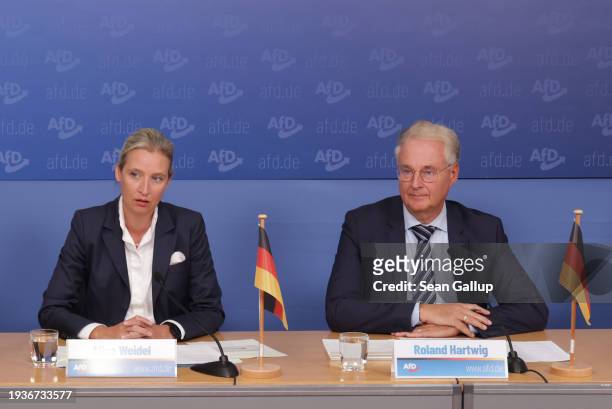 Alice Weidel , co-head of the far-right Alternative for Germany political party, and her advisor Roland Hartwig attend a press conference the day...