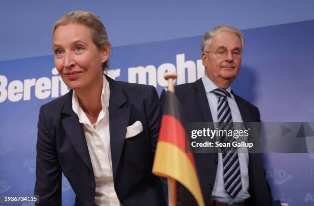 Alice Weidel , co-head of the far-right Alternative for Germany political party, and her advisor Roland Hartwig arrive for a press conference the day...