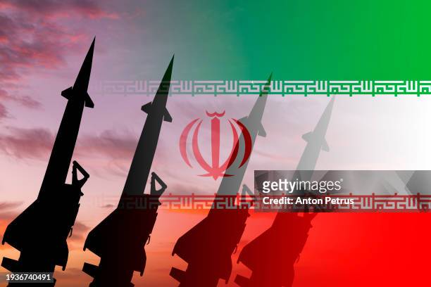 missiles against the background of the iranian flag - luchtaanval stockfoto's en -beelden