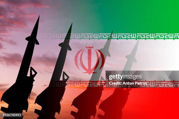 missiles against the background of the iranian flag - onbemand luchtvaartuig stockfoto's en -beelden