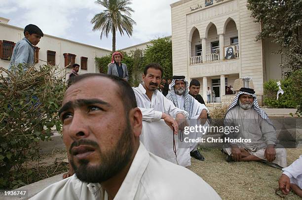 Supporters of Abbas Abu Argif, known as Said Abbas, camp out on the lawn of the city hall April 17, 2003 in Al-Kut, Iraq. Said Abbas, a Shiite...