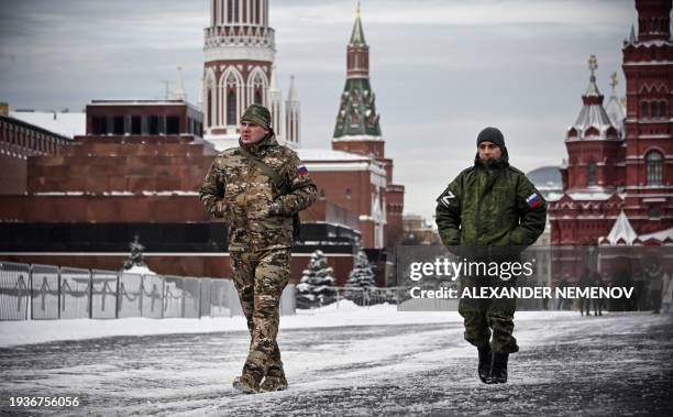 Men wearing military uniforms bearing a Z letter, an insignia of Russian troops in Ukraine, walk along the Red square in Moscow, on January 19, 2024.