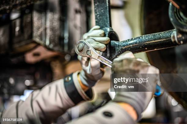 truck mechanic working in garage - image technique stock pictures, royalty-free photos & images