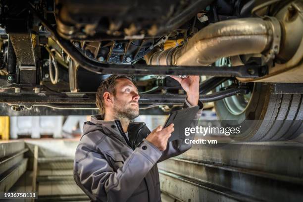 truck mechanic at work - automotive parts stock pictures, royalty-free photos & images