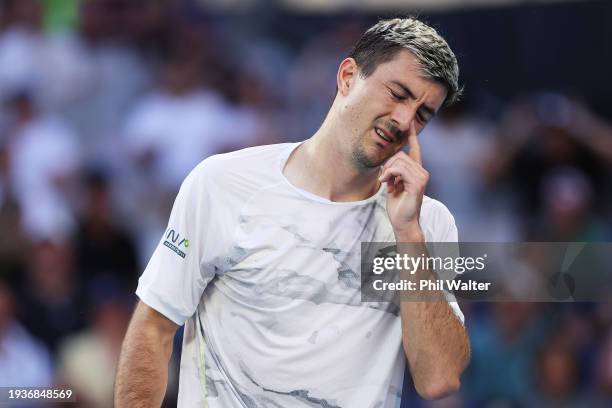 Sebastian Ofner of Austria reacts in their round one singles match against Thanasi Kokkinakis of Australia during the 2024 Australian Open at...