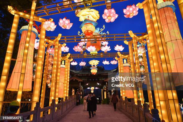 People flock to Egret Island Park to watch lanterns and light installations during the 38th China Qinhuai Lantern Festival on January 15, 2024 in...