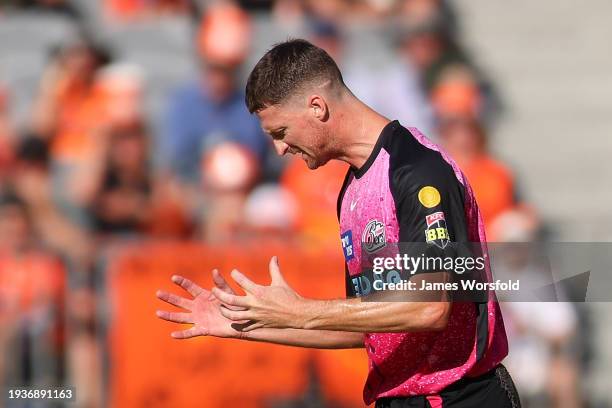 Jackson Bird of the Sixers reacts after a dropped catch during the BBL match between Perth Scorchers and Sydney Sixers at Optus Stadium, on January...