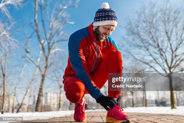 young man with ankle injury - sportsperson stock pictures, royalty-free photos & images