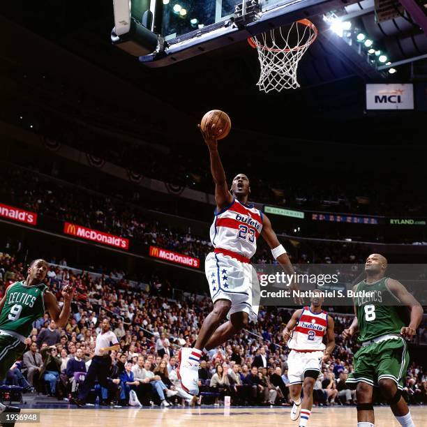 Michael Jordan of the Washington Wizards drives to the basket for a layup during his final NBA game against the Boston Celtics at the MCI Center on...