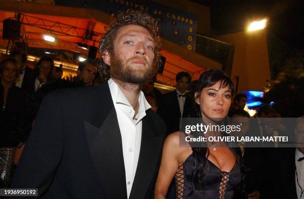 Italian actress Monica Bellucci and French actor Vincent Cassel leave the palais des festivals after the screening of their controversial film...